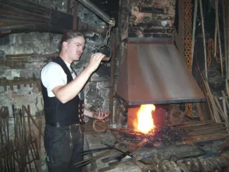 Schmied bei der Arbeit, Langmeil