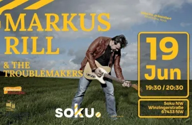 Ein Musiker steht mit einer Gitarre in einem weiten grünen Feld. Das Bild kündigt ein Konzert mit Markus Rill und den Troublemakers an.
