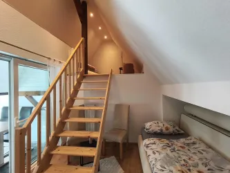 Ein weiteres Zimmer mit mehreren Schlafmöglichkeiten