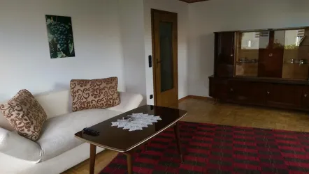 Wohnzimmer mit Schlafsofa