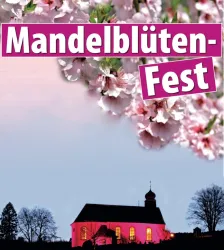 Ein festlicher Hintergrund mit Mandelblüten und einer beleuchteten Kirche. Darüber steht "Mandelblüten-Fest".