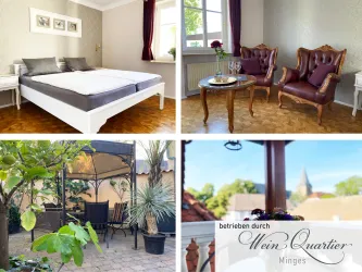 Eine gemütliche Unterkunft mit einem Schlafzimmer und stilvollen Sesseln. Der Außenbereich bietet eine entspannte Terrasse mit Pflanzen und Sitzgelegenheiten.