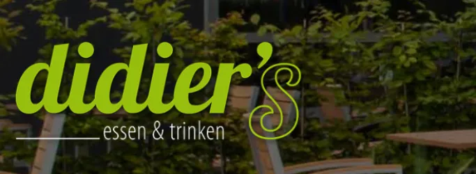 Ein modernes Restaurant mit dem Namen "didier's". Die Atmosphäre ist freundlich und einladend, um Essen und Trinken zu genießen.