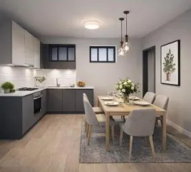 Eine moderne Küche mit einem gemütlichen Esstisch. Der Raum hat helle Wände und stilvolle Möbel.