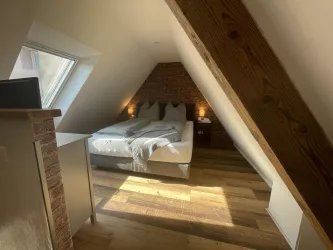 Gästezimmer Backsteinwand