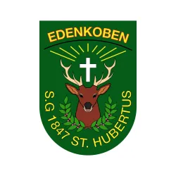 Ein Wappen der Stadt Edenkoben mit einem Reh und einem Kreuz. Die Jahreszahl 1847 und der Schriftzug "S.G. 1847 St. Hubertus" sind ebenfalls zu sehen.