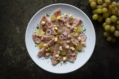 Schwartenmagensalat mit Munster-Trauben-Vinaigrette