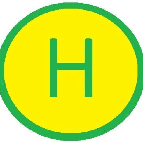 Ein kreisförmiges Schild mit einem grünen Rand und einem gelben Hintergrund. In der Mitte steht ein großer, grüner Buchstabe „H“.