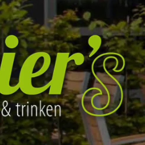 Ein modernes Restaurant mit dem Namen "didier's". Die Atmosphäre ist freundlich und einladend, um Essen und Trinken zu genießen.