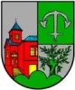 Das Ortwappen von Seelen zeigt eine beleuchtete Kirche auf der linken Hälfte und einen Baum und einen Anker auf der rechten Hälfte